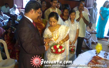 Savio Nimy Wedding Ring Exchange Photo